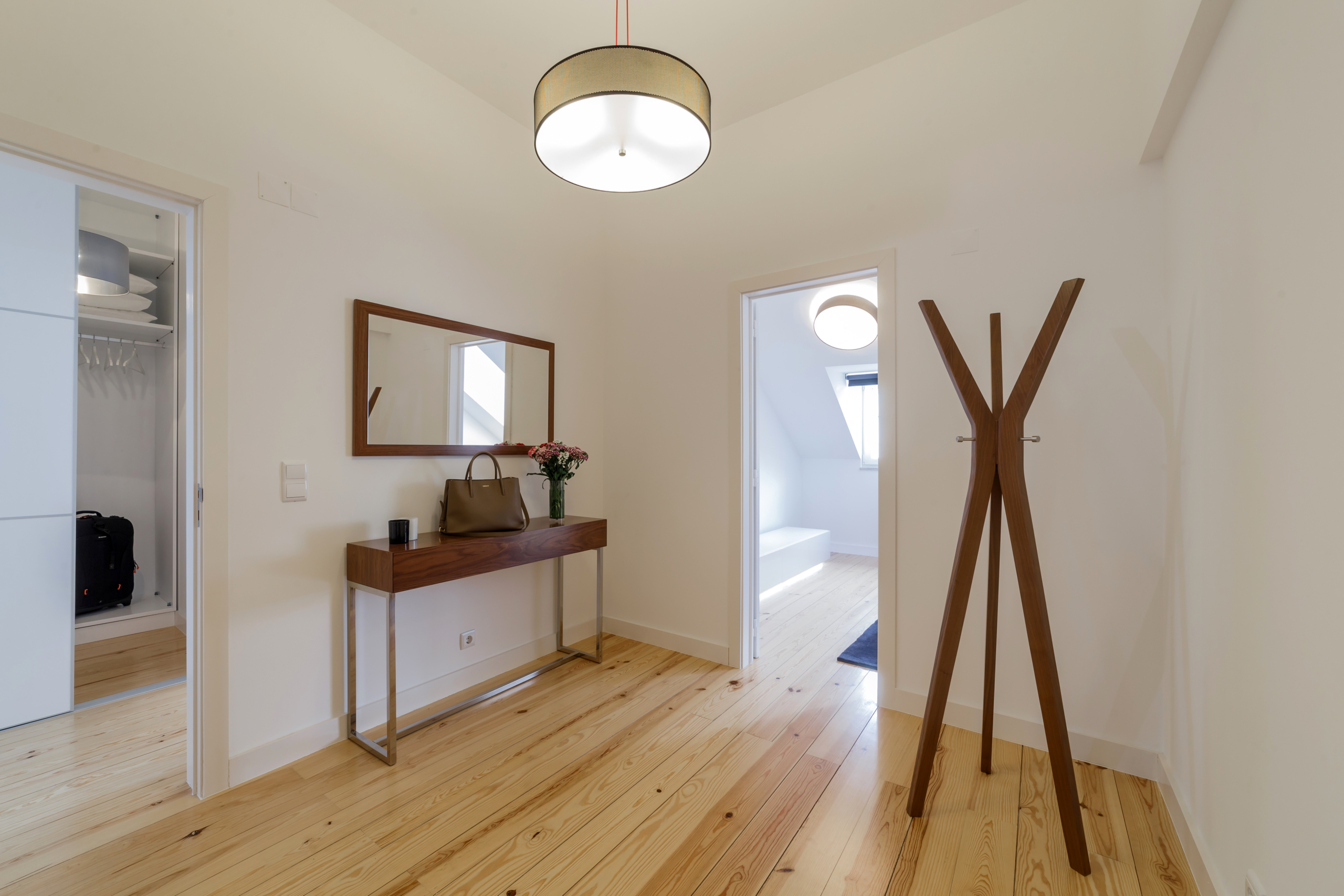 Modern apartment with white walls and light wooden floor Spacious duplex